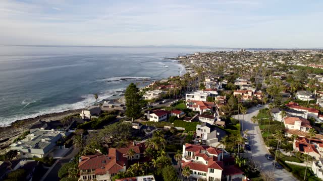 Aerial view of a residential street, the surf and the skyline at Bird Rock.