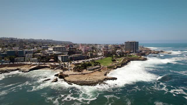 Aerial view of the cliffs, the ocean and homes at La Jolla Cove.