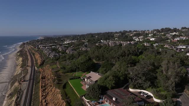 Aerial view of the cliffs, the ocean and homes in Del Mar.