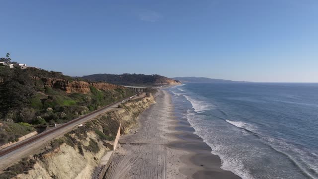 Aerial view of the cliffs, the surf and the ocean in Del Mar.