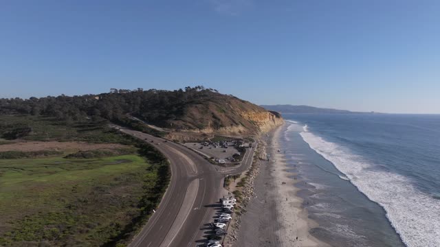 Aerial view of the cliffs, the surf and the ocean at Torrey Pines.