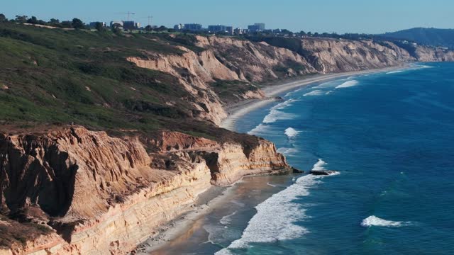 Aerial view of the cliffs, the surf and the ocean at Torrey Pines.