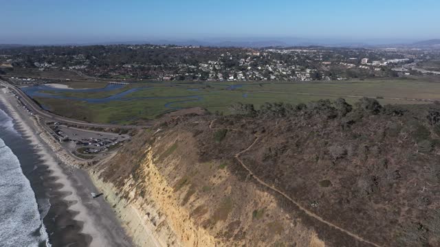 Aerial view of the cliffs, the ocean and homes at Torrey Pines.