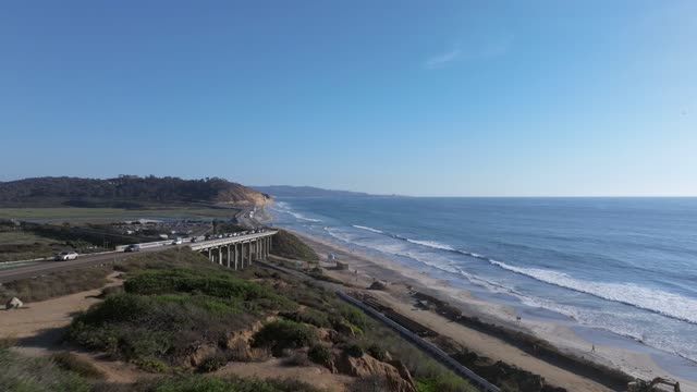 Aerial view of the cliffs, the surf and the ocean in Del Mar.