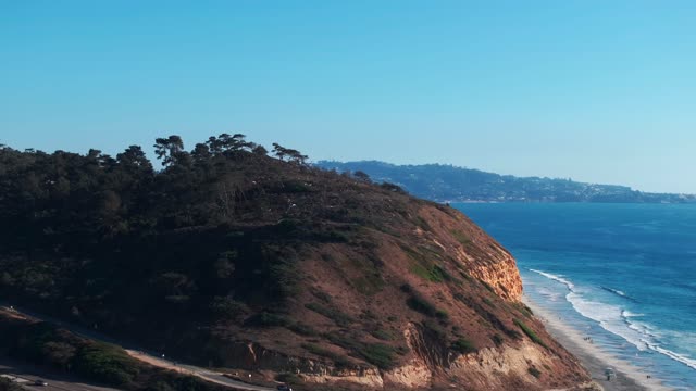 Aerial view of the cliffs, the surf and the ocean at Torrey Pines.