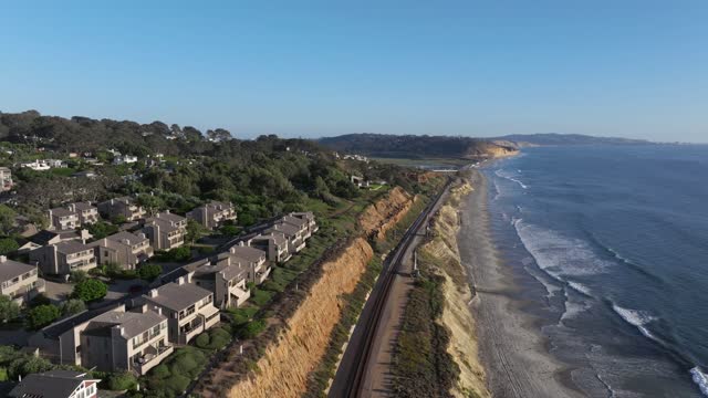 Aerial view of the cliffs, the ocean and homes in Del Mar.