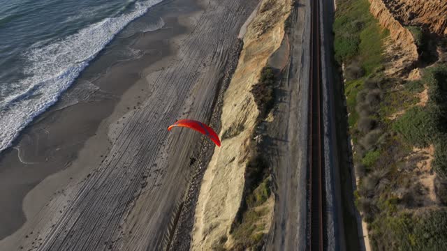 Aerial view of the cliffs, the surf and the ocean in Del Mar.