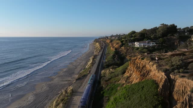 Aerial view of the cliffs, the ocean and homes in Del Mar.