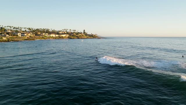 Surfers at Windansea Beach in La Jolla San Diego California during Sunset | Drone Video – 3
