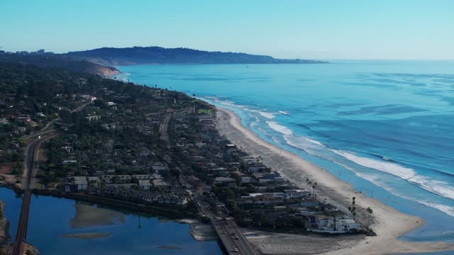 Aerial view of the beach, the ocean and homes in Del Mar.