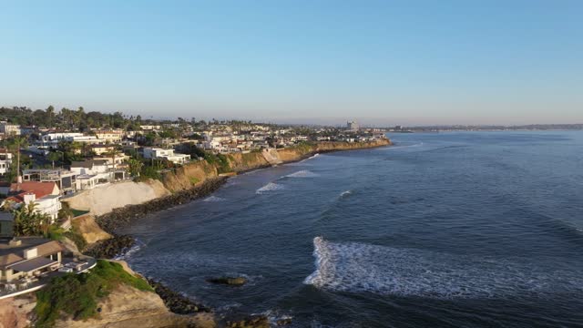 Aerial view of the cliffs, the surf and the ocean at Bird Rock.