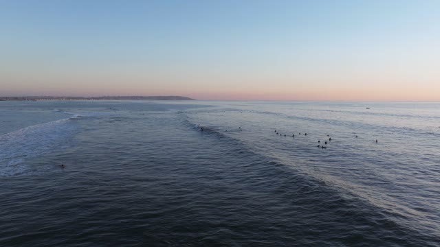 Aerial footage of surfers off the coast of Bird Rock La Jolla and Calumet Park during a beautiful sunset and twilight | Drone Video – 23
