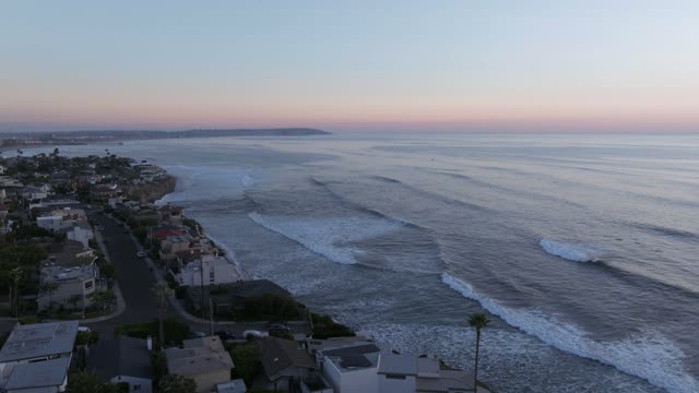 Aerial view of the beach, the surf and palm trees at Bird Rock.