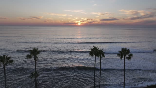 Aerial footage of surfers off the coast of Bird Rock La Jolla and Calumet Park during a beautiful sunset and twilight | Drone Video – 29