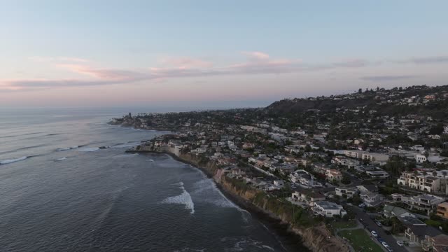 Aerial view of the cliffs, the surf and the ocean at Bird Rock.