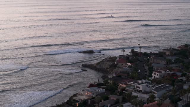 Aerial view of a residential street, the surf and palm trees at Bird Rock.