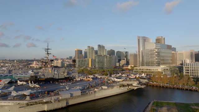 Low aerial view of the harbor, the skyline and boats at Embarcadero.