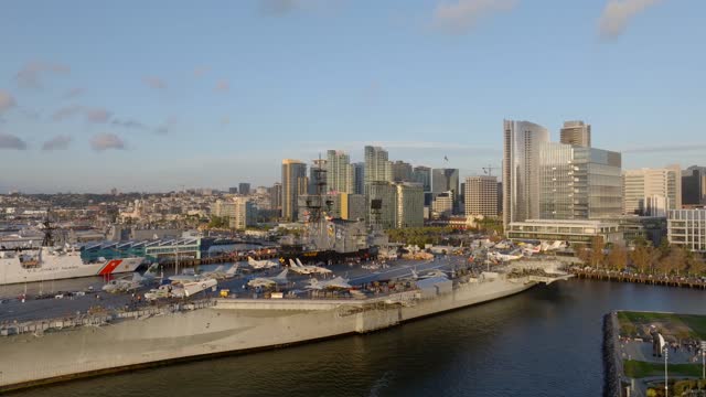 Low aerial view of the harbor, the skyline and boats at Embarcadero.
