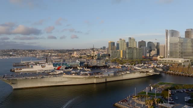Low aerial view of the harbor, the skyline and boats at Embarcadero.