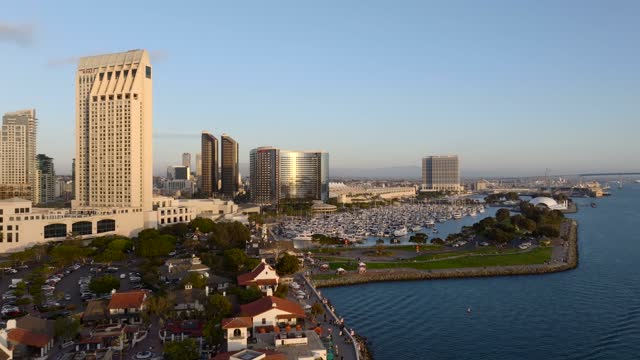 Aerial footage of the Downtown San Diego Skyline Waterfront and Embarcadero during Sunset | Drone Video