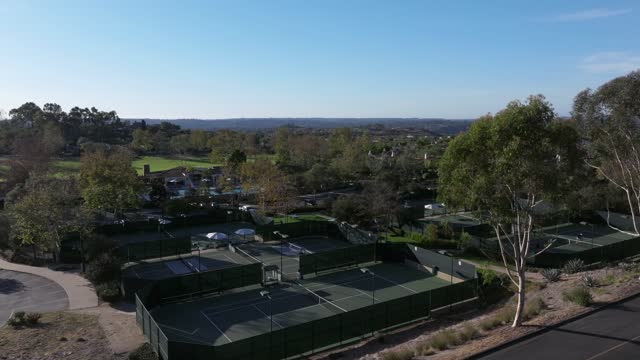Low aerial view of the country inland, homes and open country in Santaluz.