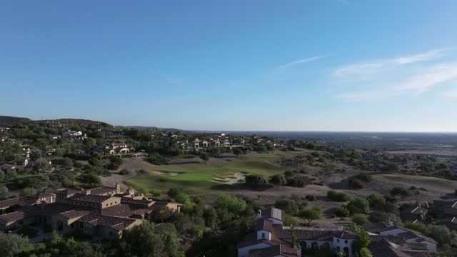 Aerial view of the country inland, homes and the buildings in Santaluz.