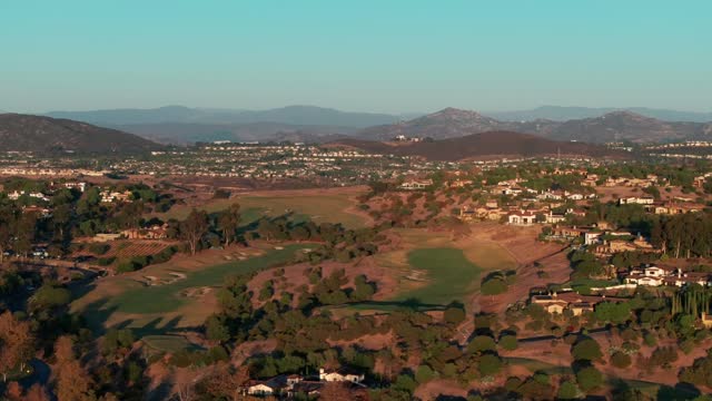 Aerial view of the country inland, homes and open country in Santaluz.