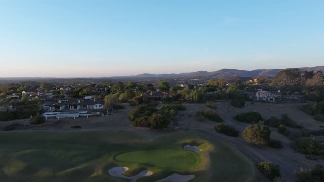 Aerial view of the country inland, homes and open country in Santaluz.