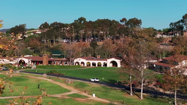 Aerial footage of the Clubhouse at the Private Country Club Golf Club and Golf Course Santaluz on a sunny day | Drone Video – 1