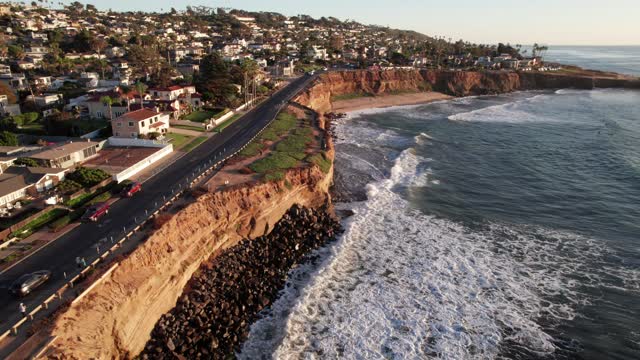 Aerial view of the cliffs, the surf and the ocean at Sunset Cliffs.