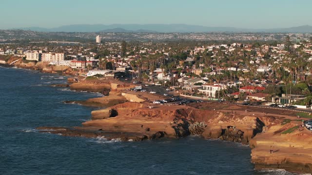 Aerial view of the cliffs, palm trees and the ocean at Sunset Cliffs.
