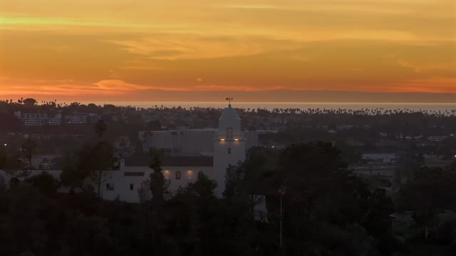 The Junipero Serra Museum in Presidio Park in Mission Hills overlooking Mission Valley during Sunset | Drone Video – 1