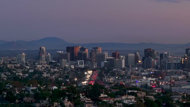 Aerial view of the downtown streets, the skyline and homes in Downtown San Diego.