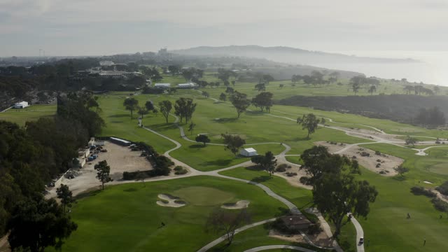 Aerial view of a park, open country and the water at Torrey Pines.