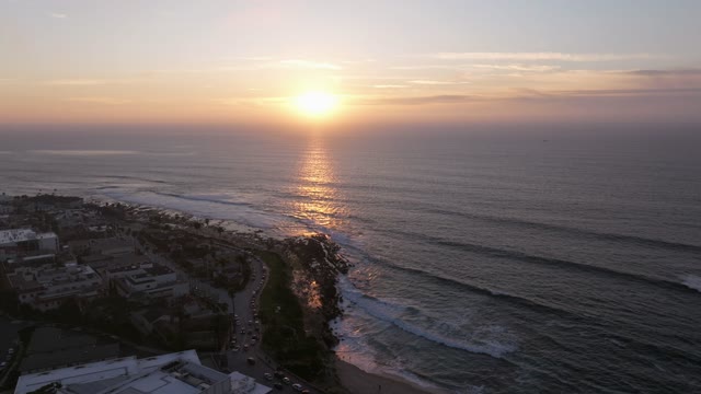Aerial view of the cliffs, the ocean and homes at La Jolla Cove.