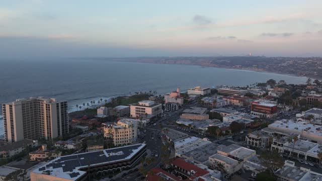Aerial view of the downtown streets, palm trees and the ocean at La Jolla Cove.