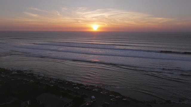 Aerial view of the beach, the surf and the ocean at Sunset Cliffs.