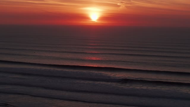 Aerial view of the beach, the surf and the ocean at Sunset Cliffs.
