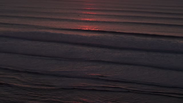 Aerial view of the beach, the surf and the ocean at Sunset Cliffs.