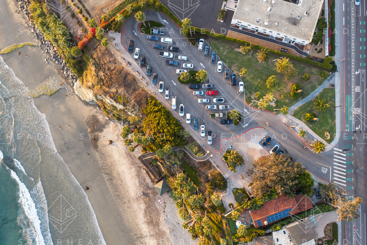 Aerial view of the beach, the surf and palm trees at Swamis.