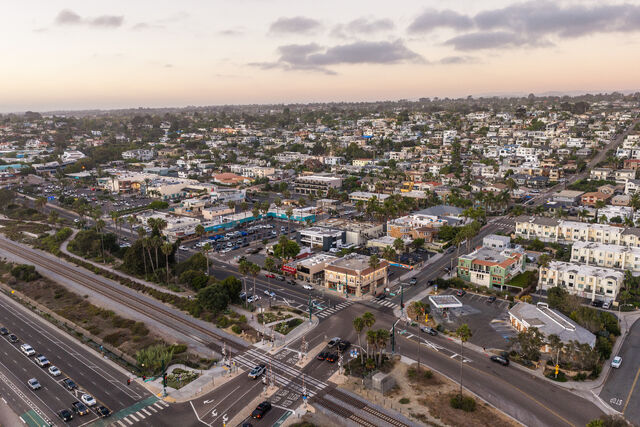 Aerial view of a residential street, palm trees and homes in Cardiff.