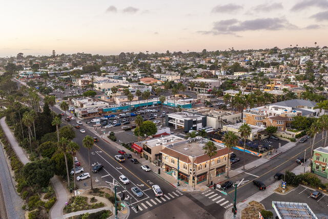 Aerial view of a residential street, palm trees and homes in Cardiff.