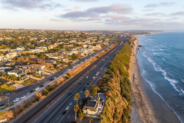 Aerial view of the beach, palm trees and the ocean at Swamis.