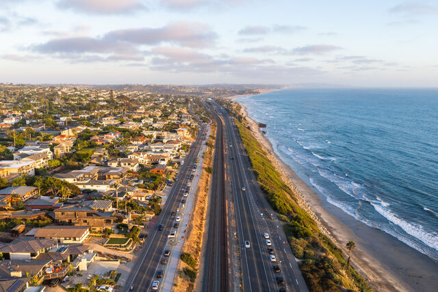 Aerial shot of the coastline and highway through Encinitas San Diego | Drone Photo