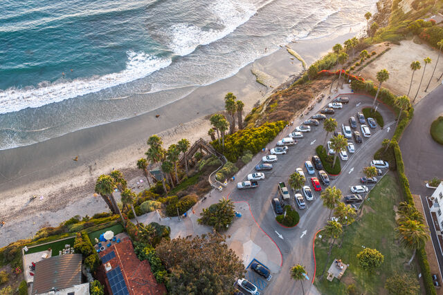 Aerial shot of Swami's Beach and parking lot in Encinitas | Drone Photo