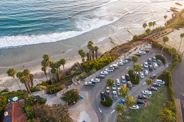 Aerial shot of Swami's Beach parking lot and coastline in Encinitas | Drone Photo