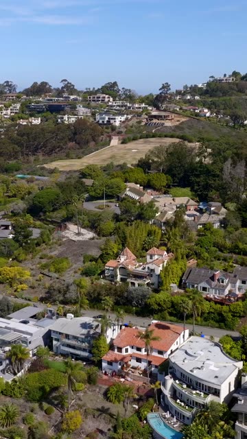 Aerial view of a residential street, palm trees and homes at Mount Soledad.