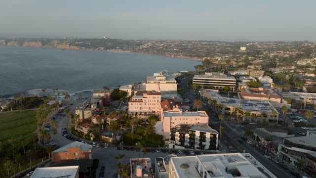 Aerial drone footage of La Valencia Hotel and La Jolla village overlooking the coastline and hillside homes in La Jolla | Drone Video